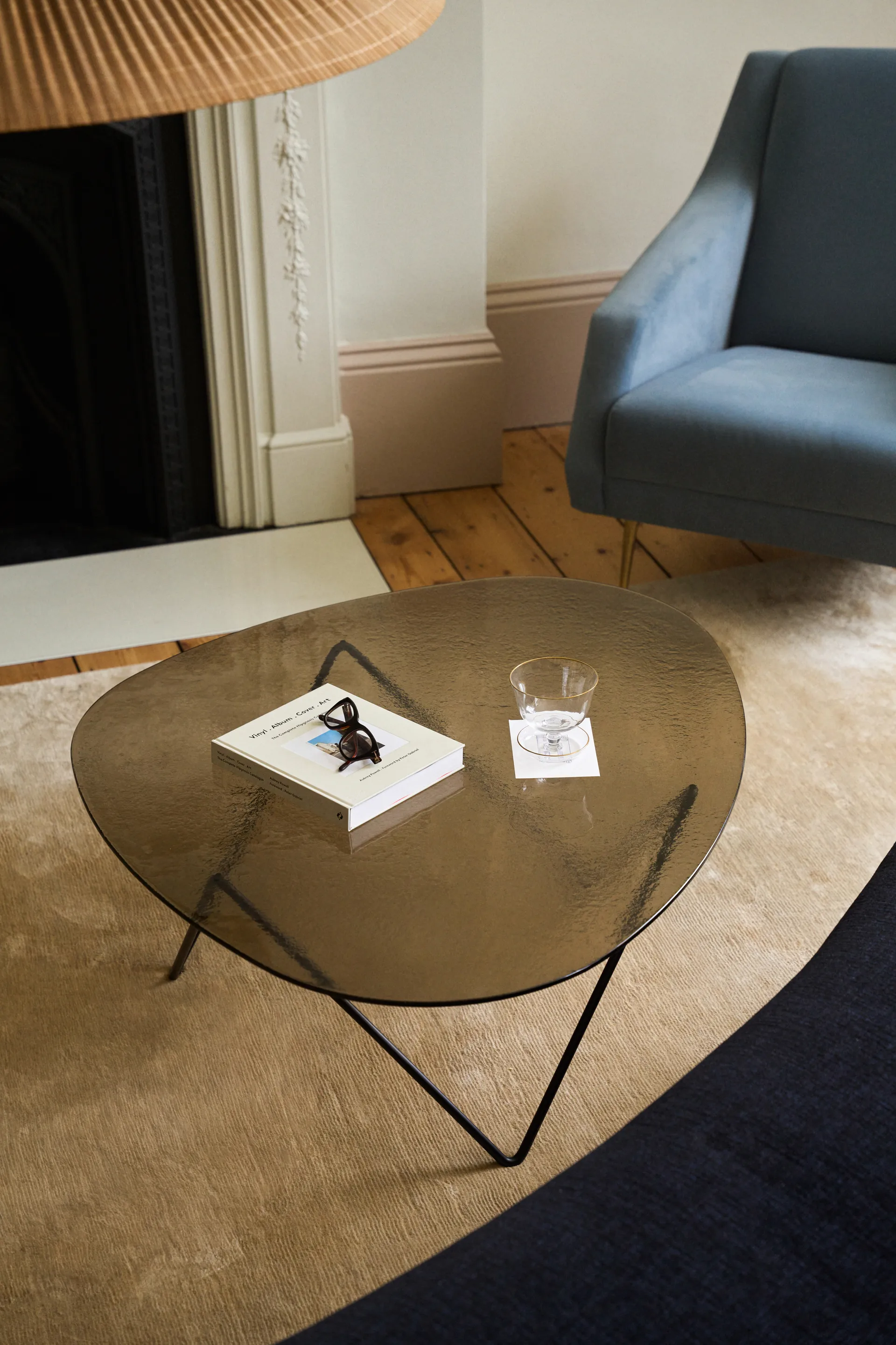 Pedrera sofa table, Black semi-matte—bronze textured glass GUBI