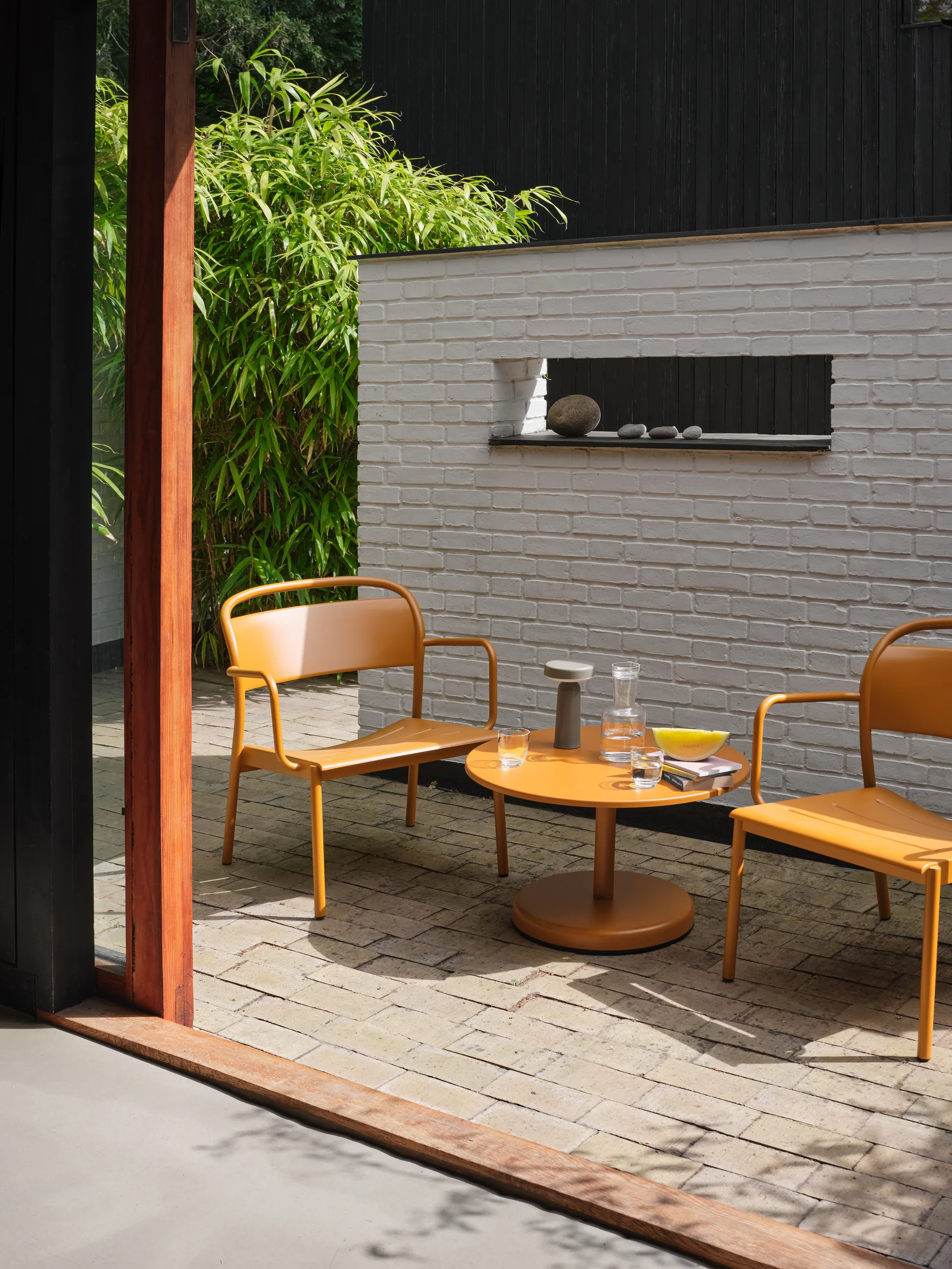 Linear Steel lounge armchair, Burnt orange Muuto