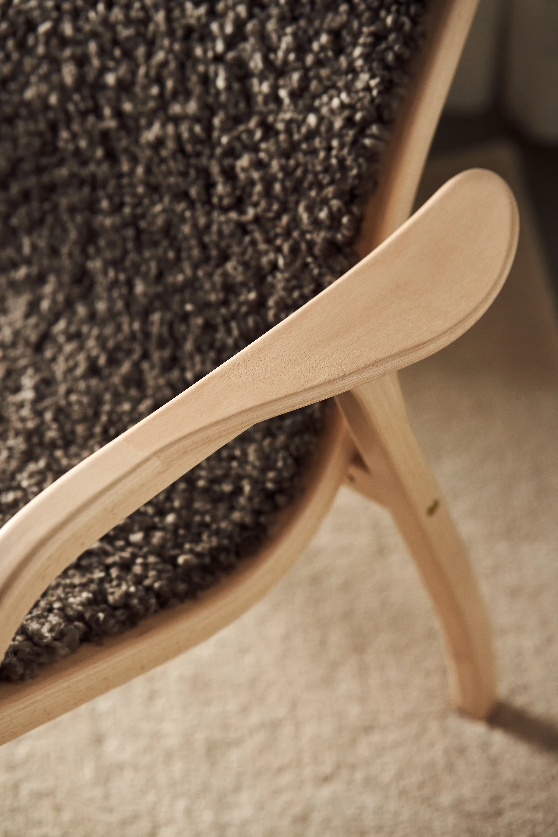 Lamino armchair and footstool varnished beech/sheepskin, Sahara (nougat-brown) Swedese